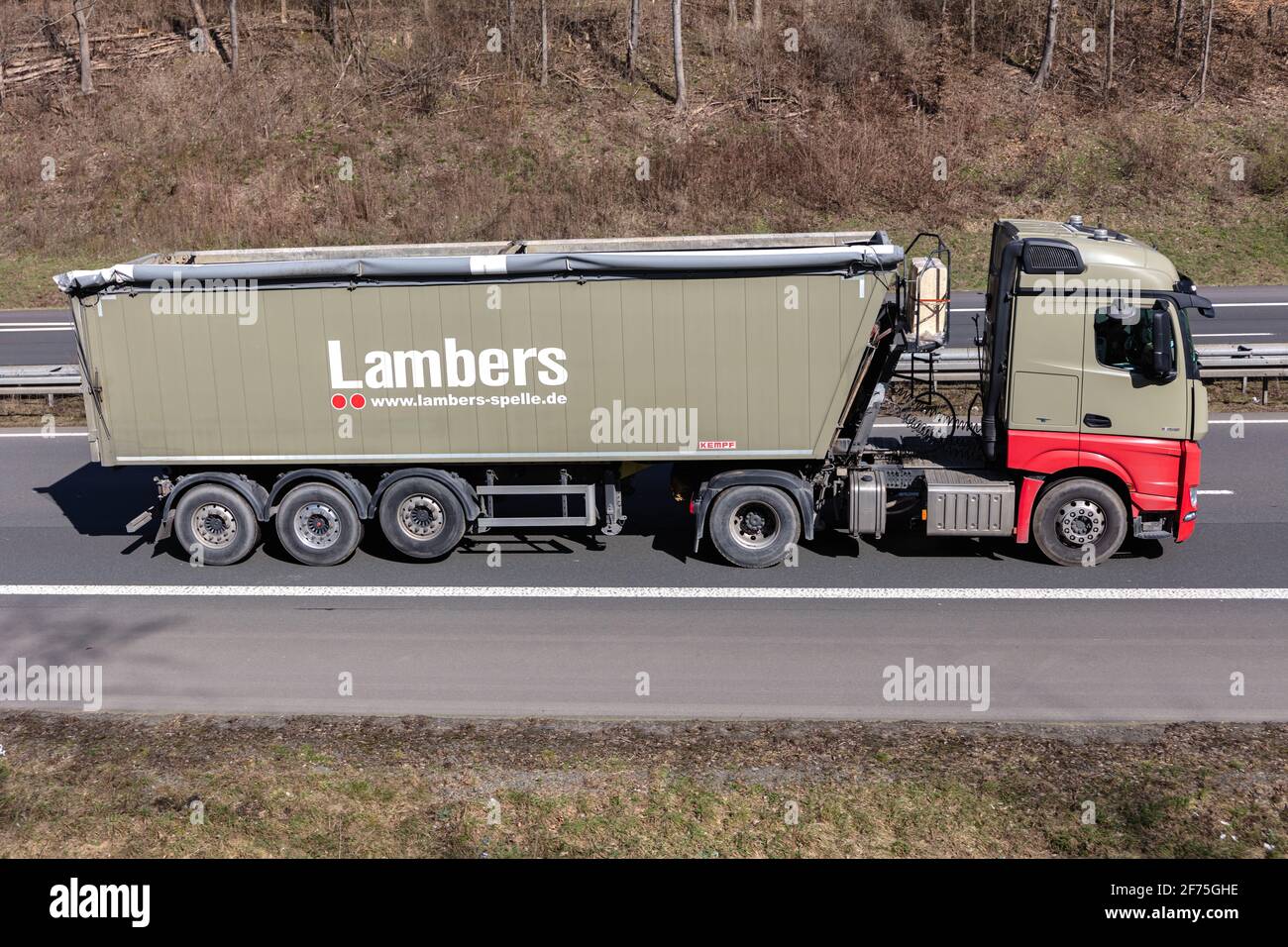 Lambers Mercedes-Benz truck with tipper trailer on motorway. Stock Photo