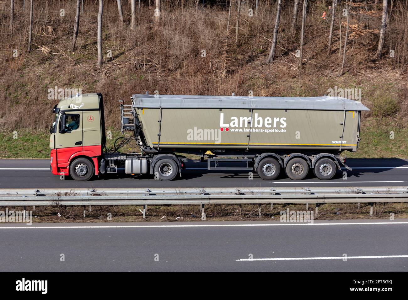 Lambers Mercedes-Benz truck with tipper trailer on motorway. Stock Photo