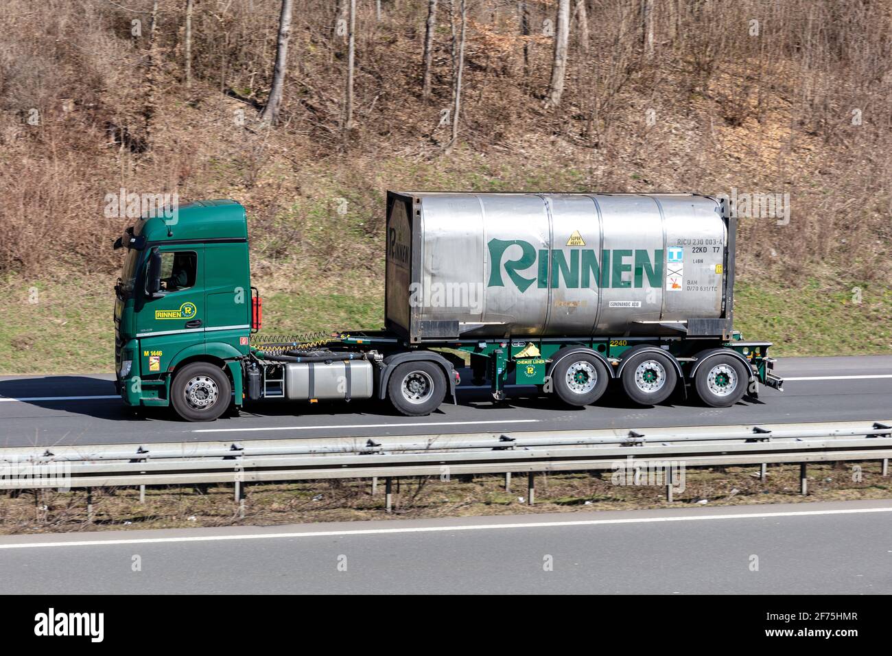 Rinnen Mercedes-Benz Actros truck with tank container on motorway. Stock Photo