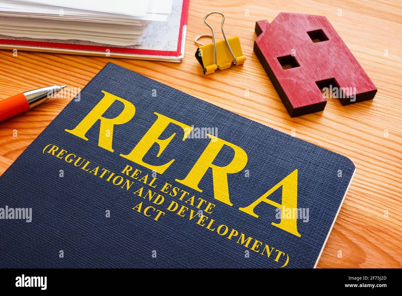 RERA or Real Estate Regulation and Development Act and red model of home. Stock Photo