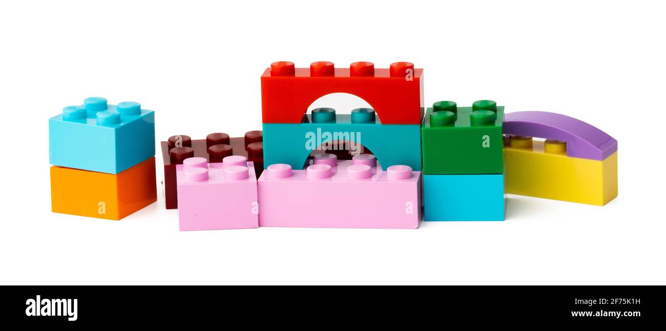 Colorful plastic toy building blocks isolated on white Stock Photo - Alamy