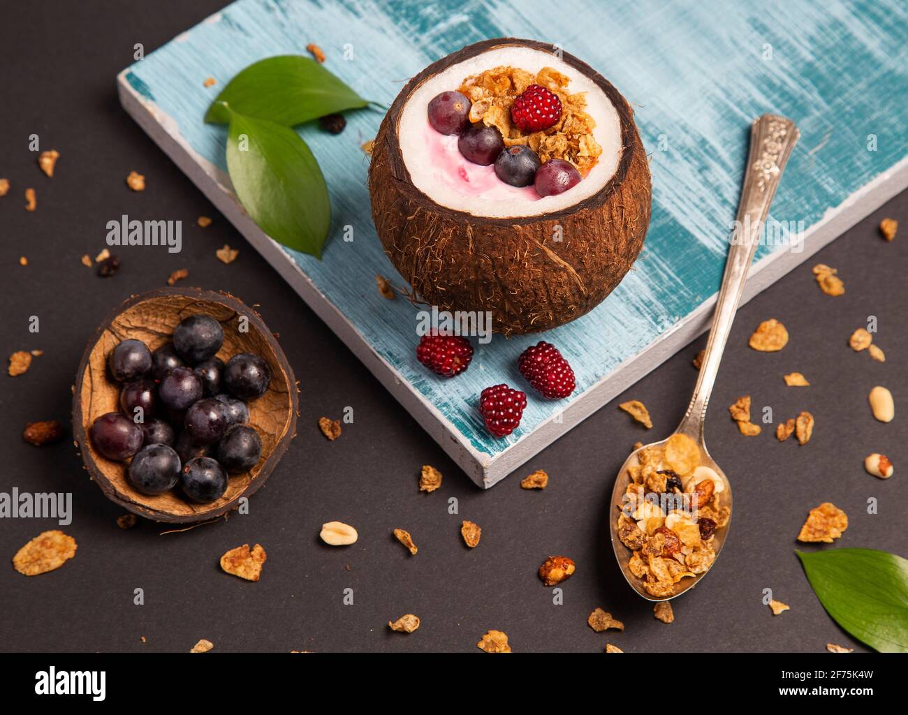 Cereal with coconut and red berries Cocos nucifera Stock Photo Alamy