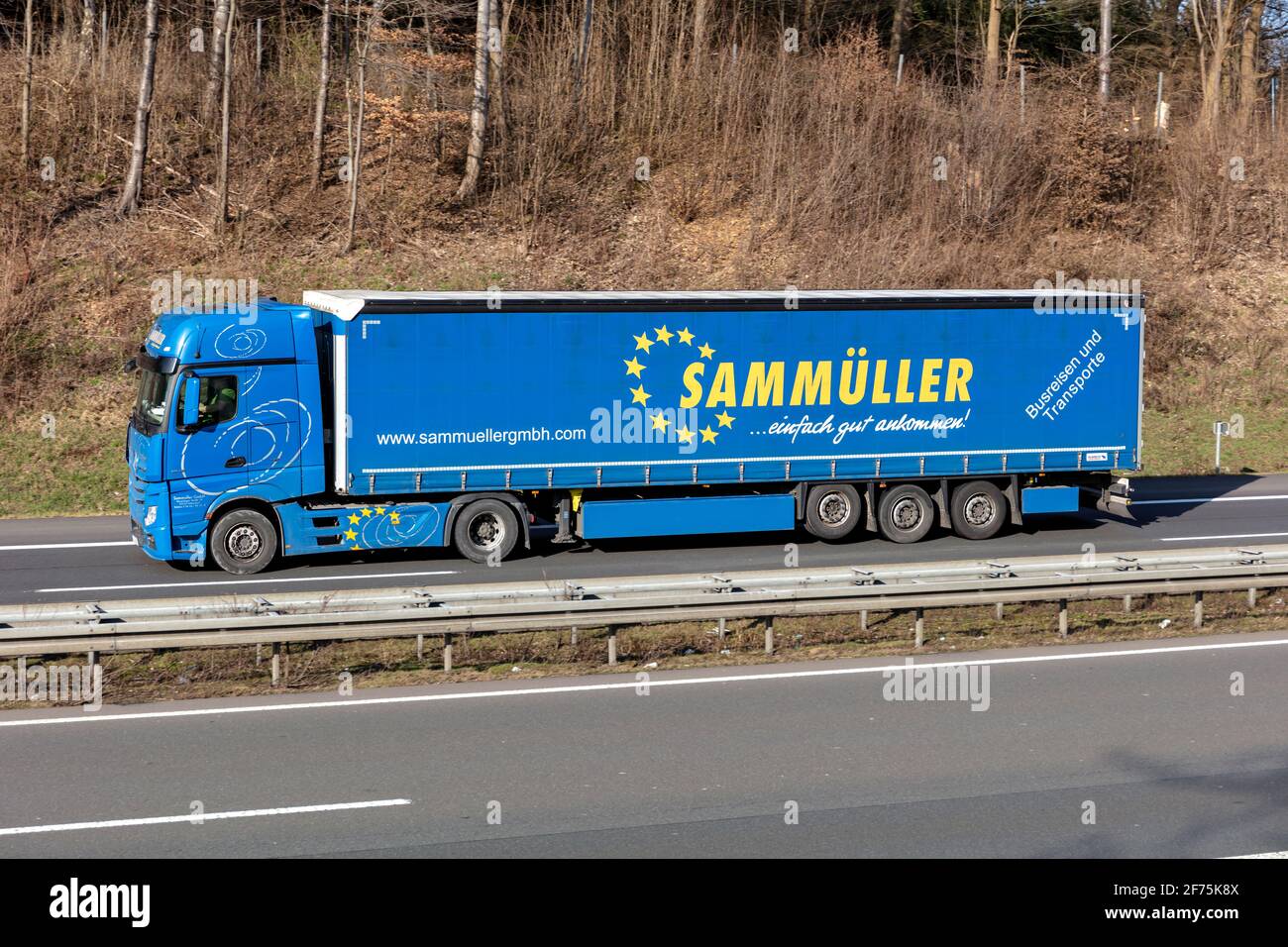 Sammueller Mercedes-Benz Actros truck with curtainside trailer on motorway. Stock Photo