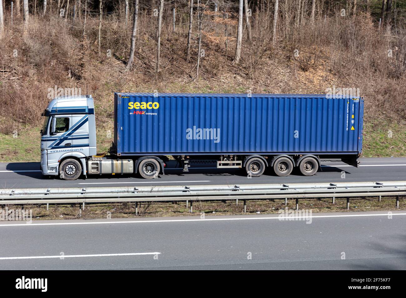 Starmans Mercedes-Benz Actros truck with seaco container on motorway. Stock Photo