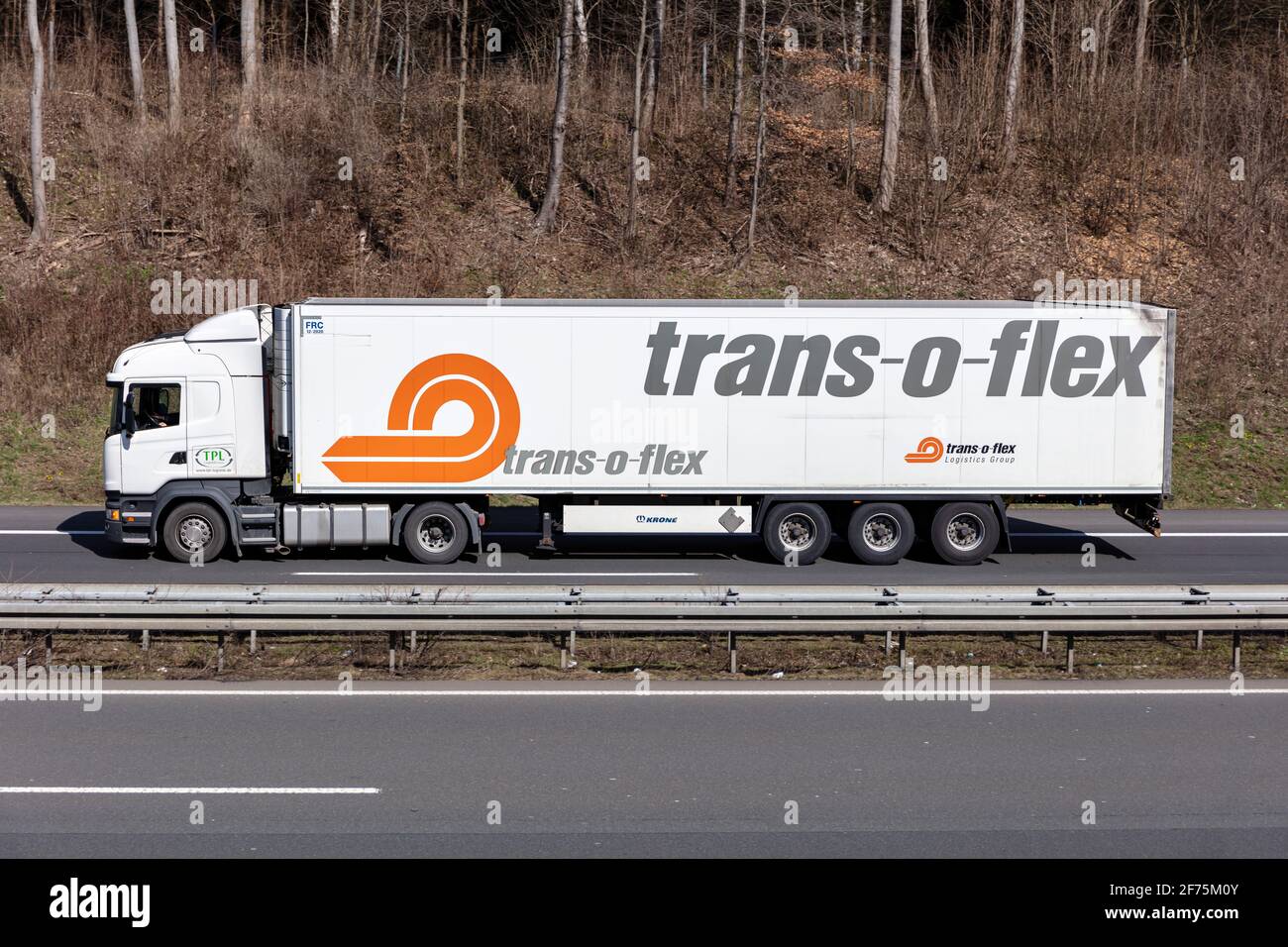 TPL Logitstik Scania truck with trans-o-flex temperature controlled trailer on motorway. Stock Photo