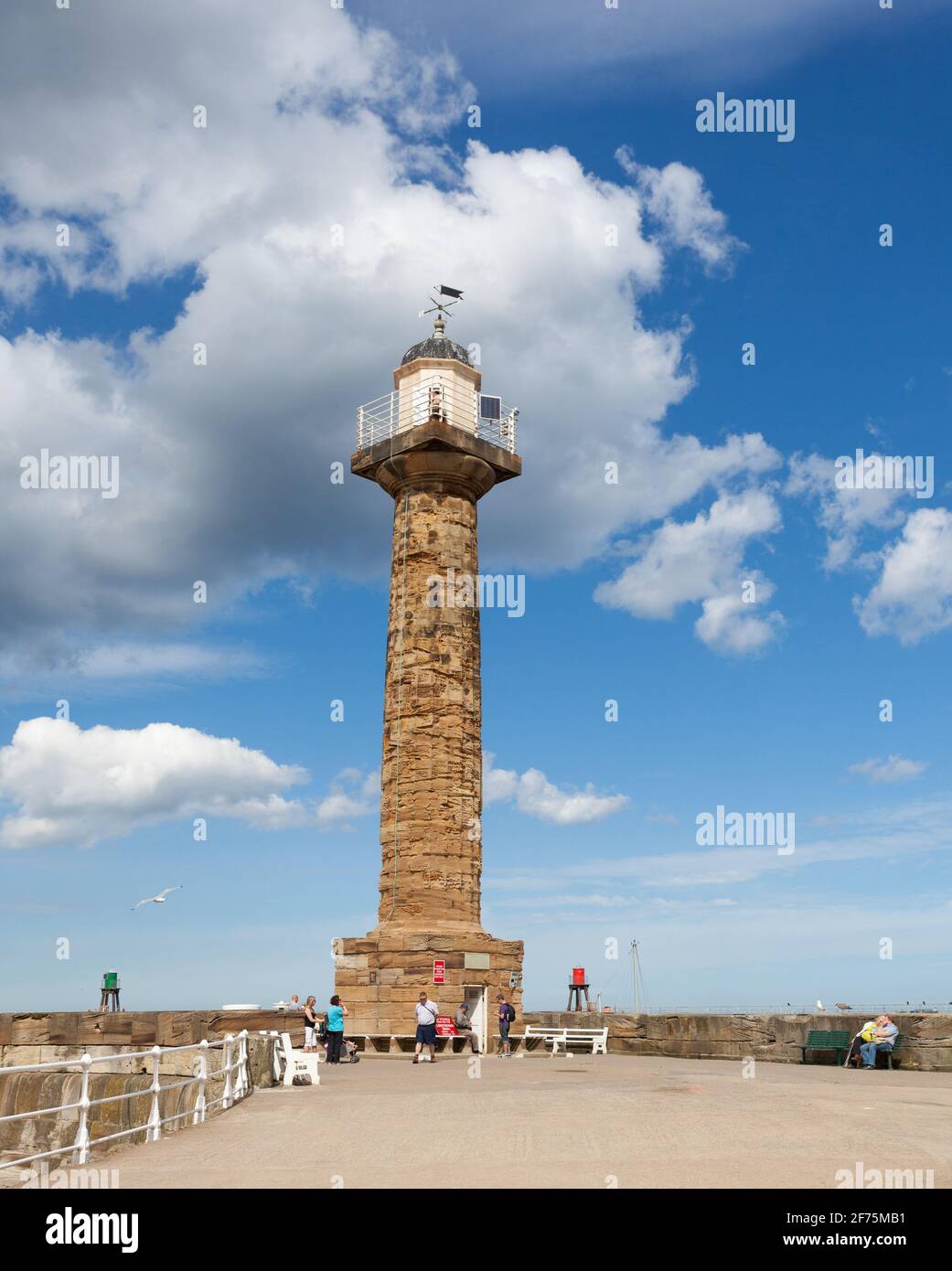 The historic lighthouse on the West pier at Whitby in North Yorkshire Stock Photo