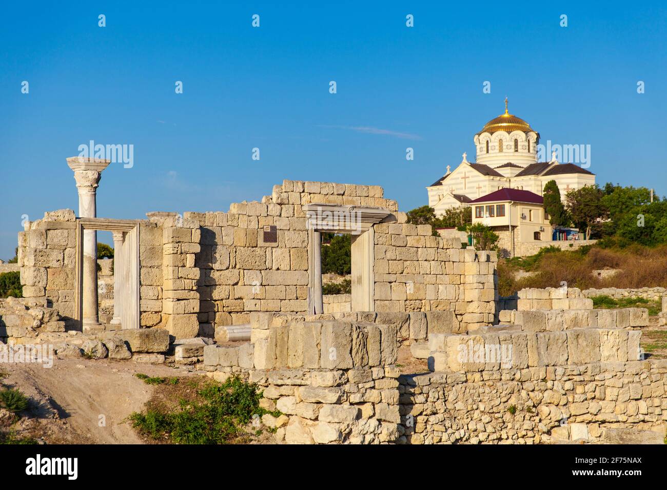 Ukraine, Crimea, Sevastopol, Ruins of Ancient City of Khersoness, Ancient theatre, St Vladimir's Cathedral in background Stock Photo