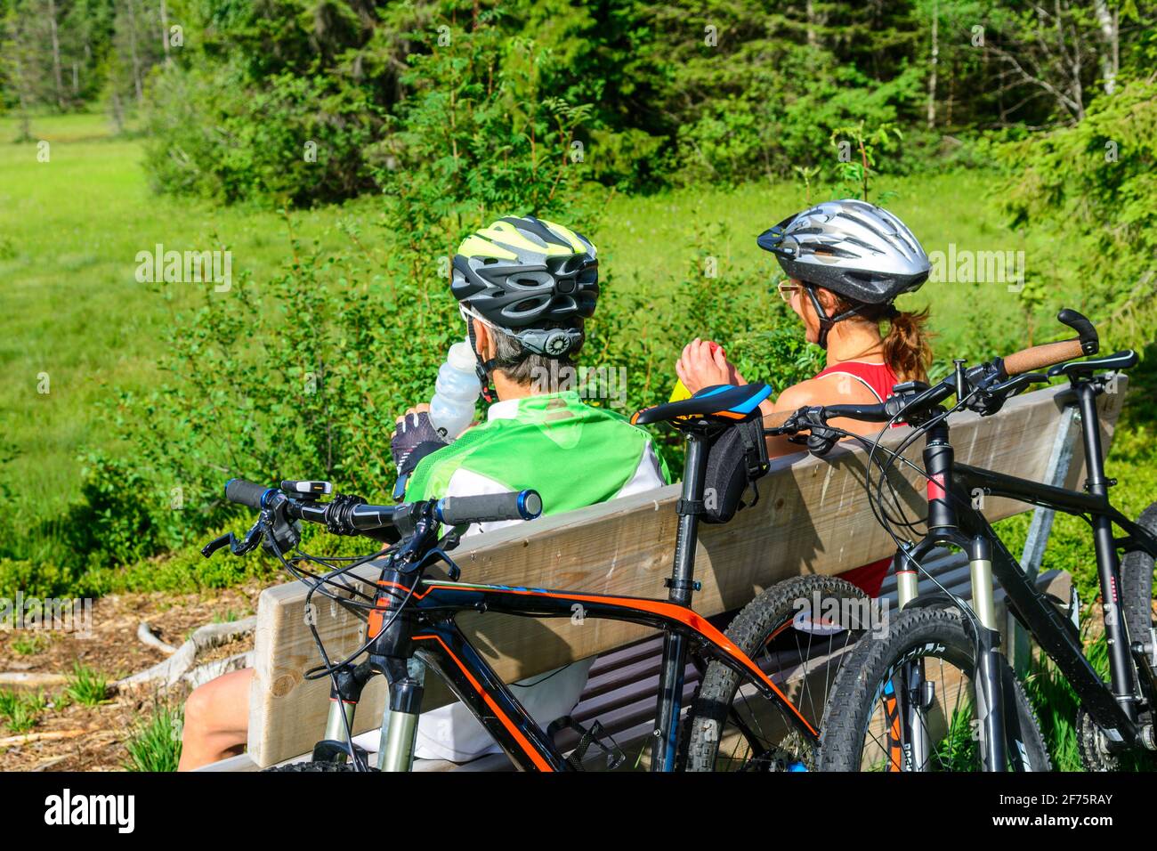 Mountainbikers enjoying the calmness in nature Stock Photo