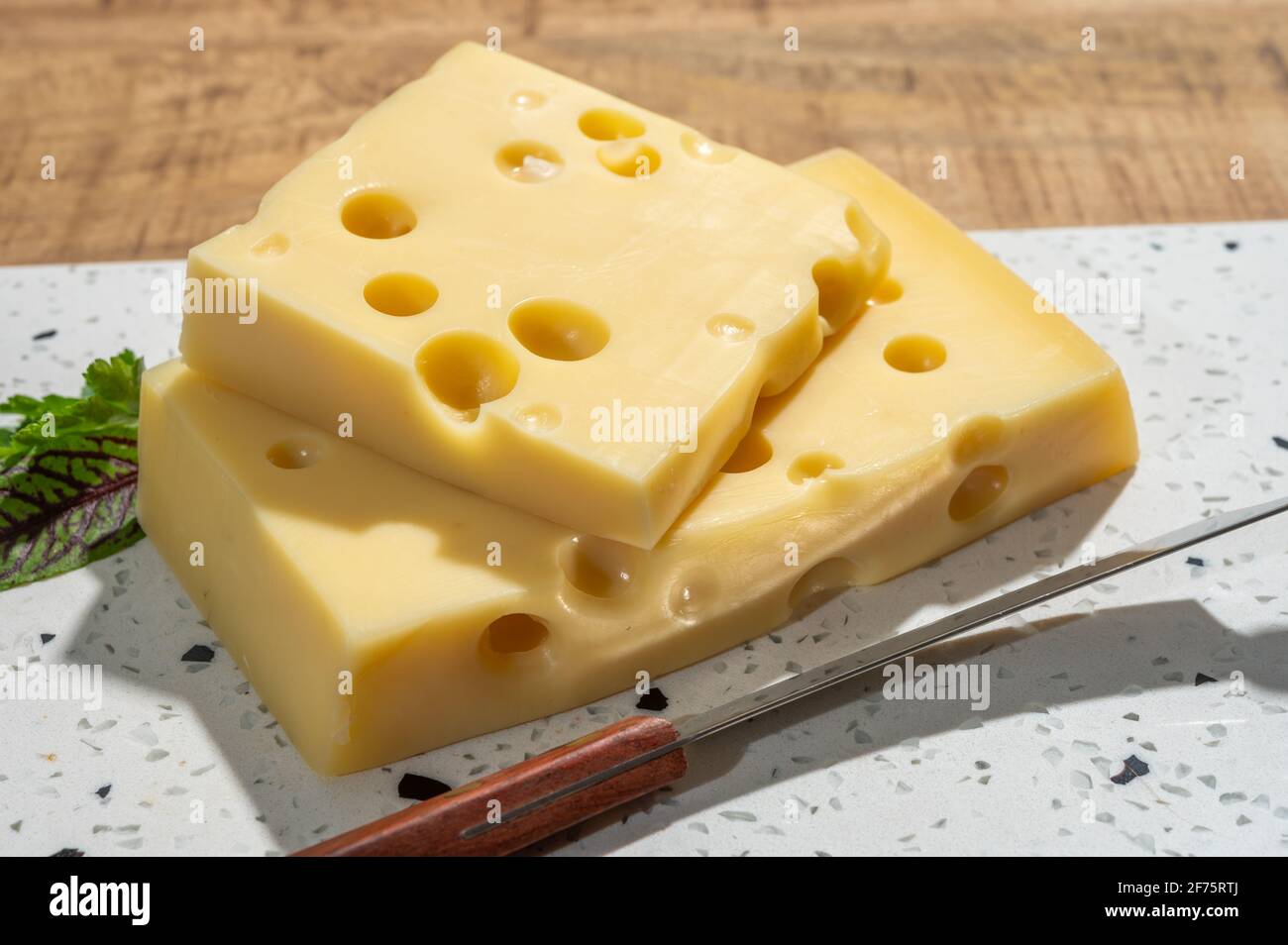 Cheese collection, blocks of French emmentaler cheese with many round