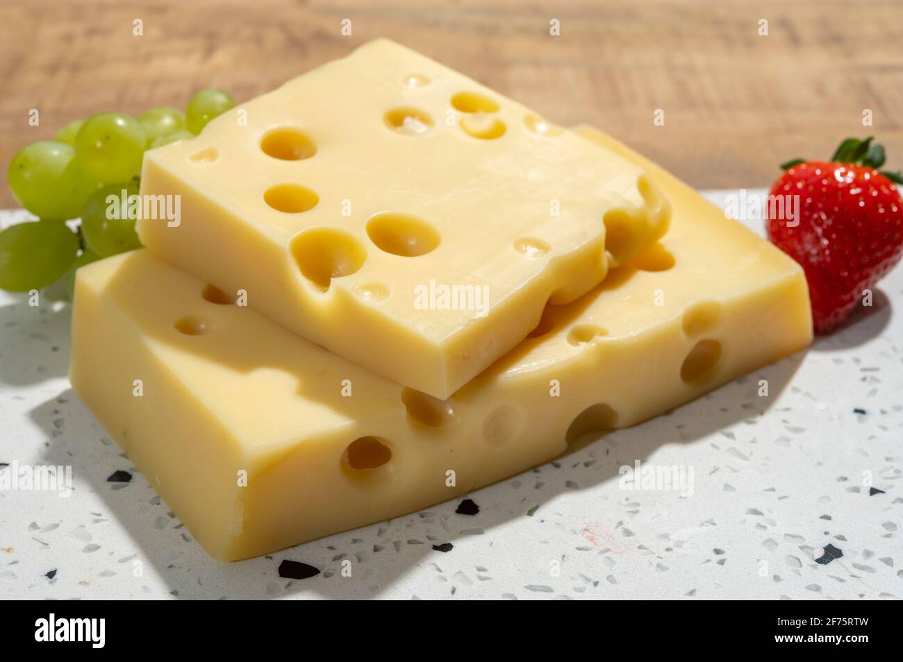 Cheese collection, blocks of French emmentaler cheese with many round
