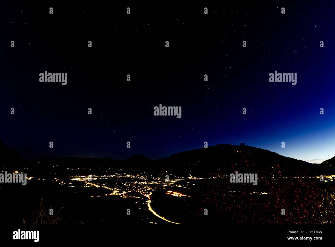 Schenna town in South Tyrol, Italy dramatic panoramic shot during a night in the spring of 2021. Stock Photo