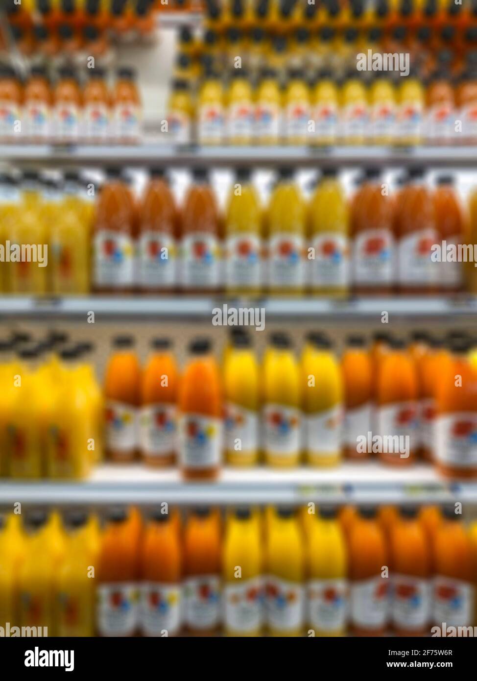 https://c8.alamy.com/comp/2F75W6R/blurred-background-with-row-of-juice-bottles-on-shelves-in-the-supermarket-2F75W6R.jpg