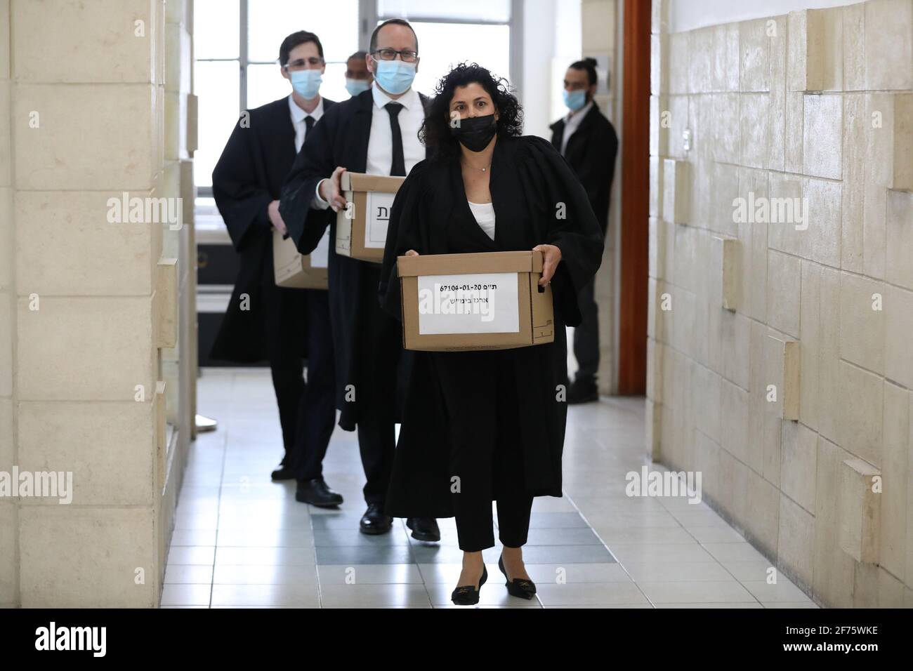 Jerusalem, Israel. 05th Apr, 2021. State attorneys carrying the prosecution materials of the Israeli Prime Minister Benjamin Netanyahu trial at the Jerusalem district court, in Salah El-Din, East Jerusalem on Monday April 5, 2021. Netanyahu attends to court to formally respond to the evidence stage of his charges of bribery, fraud and breach of trust, just weeks after the national elections. Pool Photo by Abir Sultan/UPI Credit: UPI/Alamy Live News Stock Photo