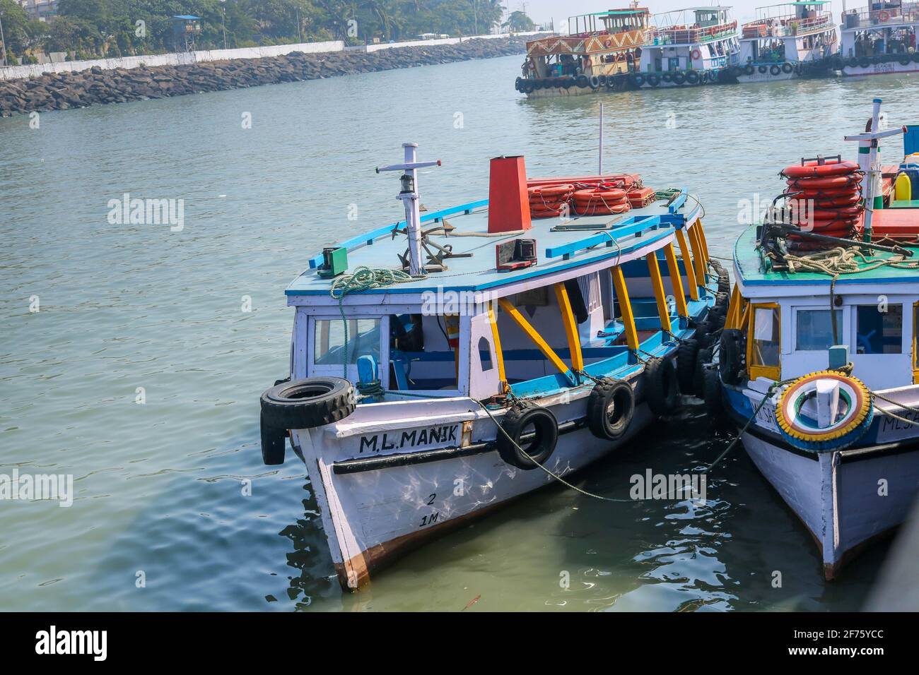 Boats near Gateway of India Mumbai, waiting for passengers to leave for Elephanta Caves. Stock Photo