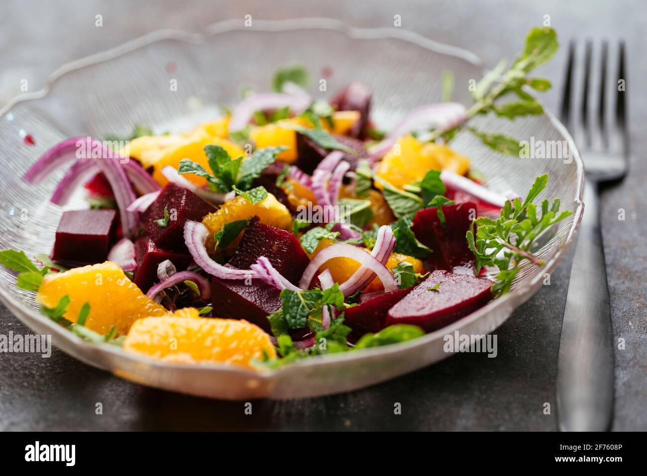 Home made beet and orange salad with mint and arugula. Stock Photo
