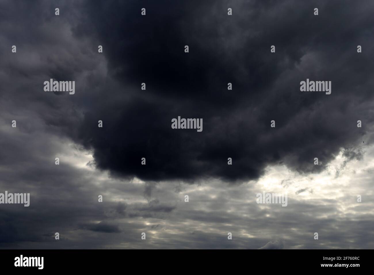 Sky covered with dark storm clouds. Dramatic background for weather before rain Stock Photo