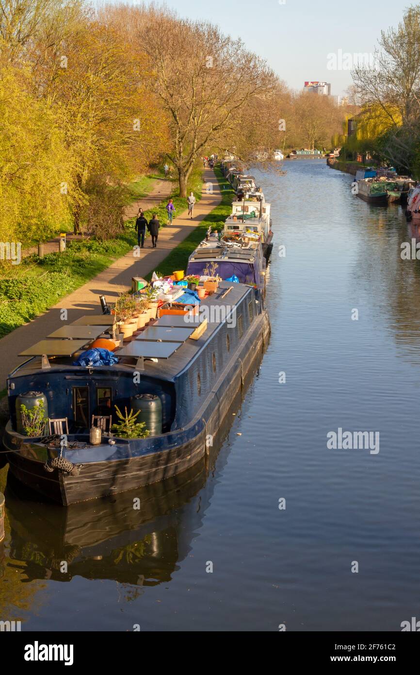 London, UK, 2020: A sunny day in Hackney during Lockdown along the river Lee with clear water Stock Photo