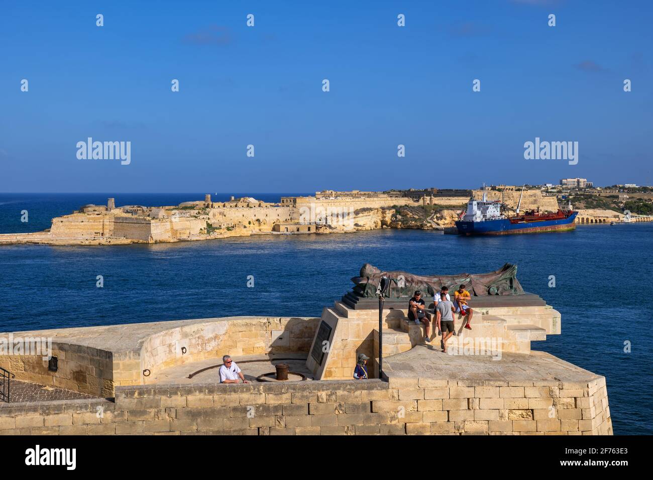 Recumbent sculpture at Siege Bell War Memorial in Valletta, Malta, Fort Ricasoli in Kalkara Stock Photo