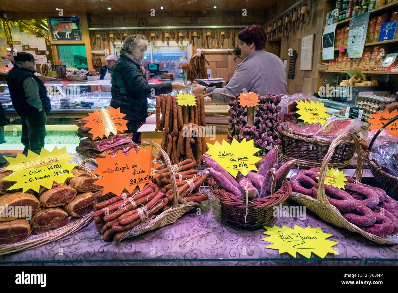 France, Alsace, Bas-Rhin, Christmas market, Bouxwiller, the butcher showcase. Stock Photo