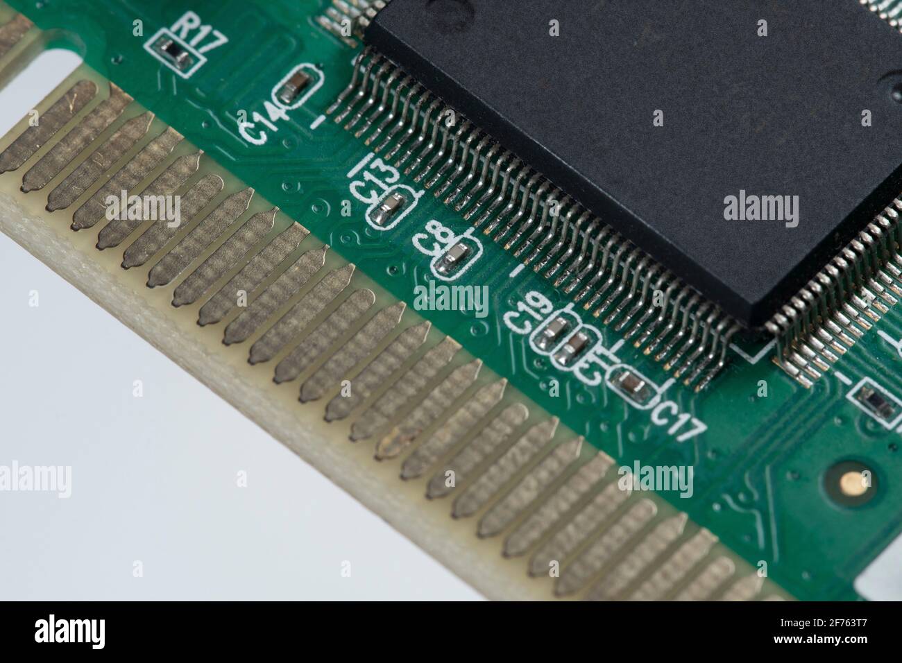 printed green circuit board with plug-in contacts chip Stock Photo