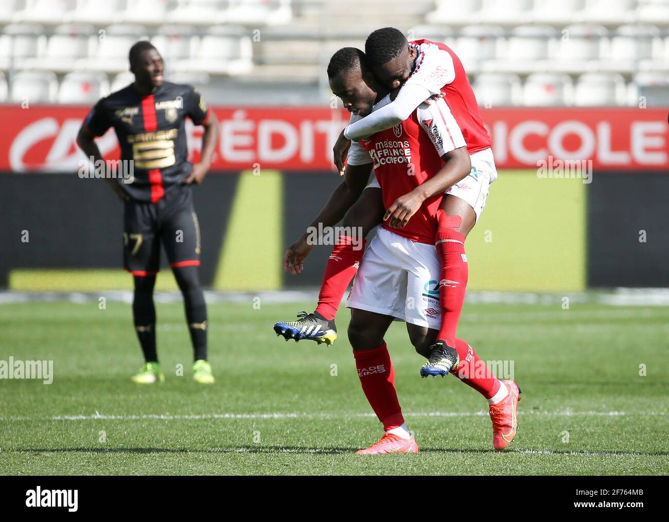 Ghislain Konan of Reims celebrates his goal with Moreto Cassama during the  French championship Ligue 1 football match between Stade de Reims and Stade  Rennais (Rennes) on April 4, 2021 at Stade