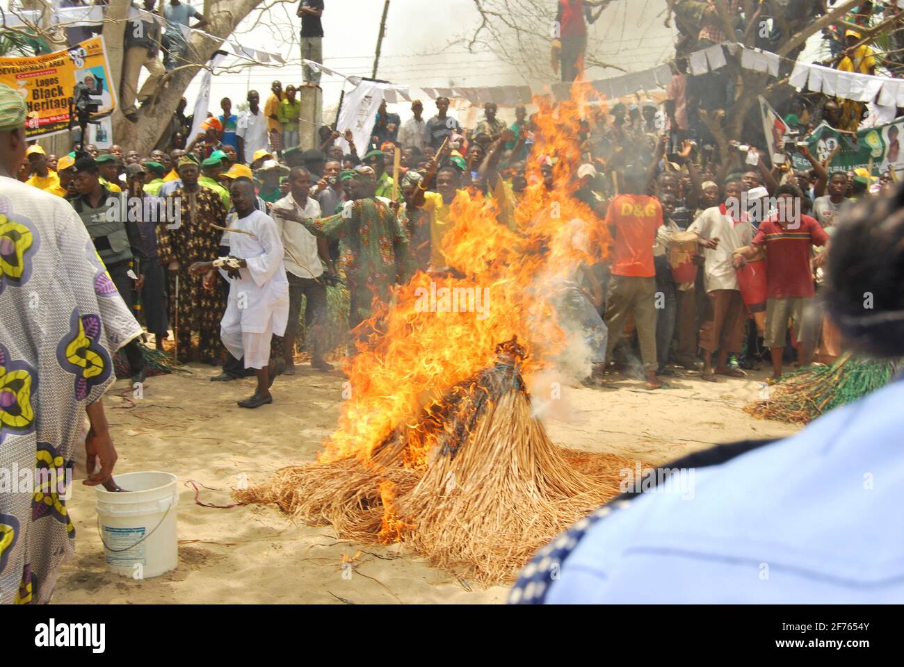 A man burning Zenbgeto Masquerade to showcase Africans Magical Power at the Annual Black Heritage Festival, Badagry, Lagos Nigeria. Stock Photo