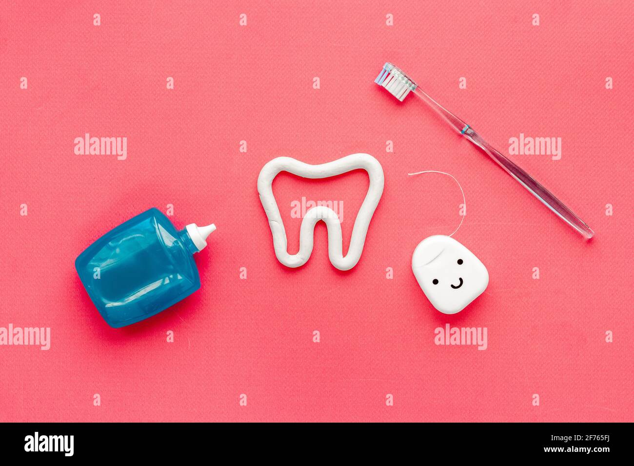 Toothbrush with tube of toothpaste and dental floss. Oral care and ...