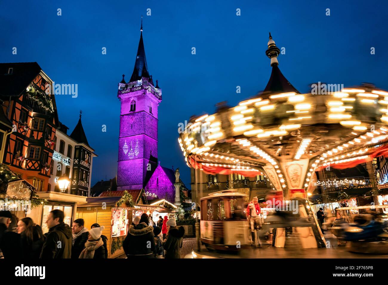 France, Alsace, Bas-Rhin, Obernai, Christmas market and carousel. Stock Photo