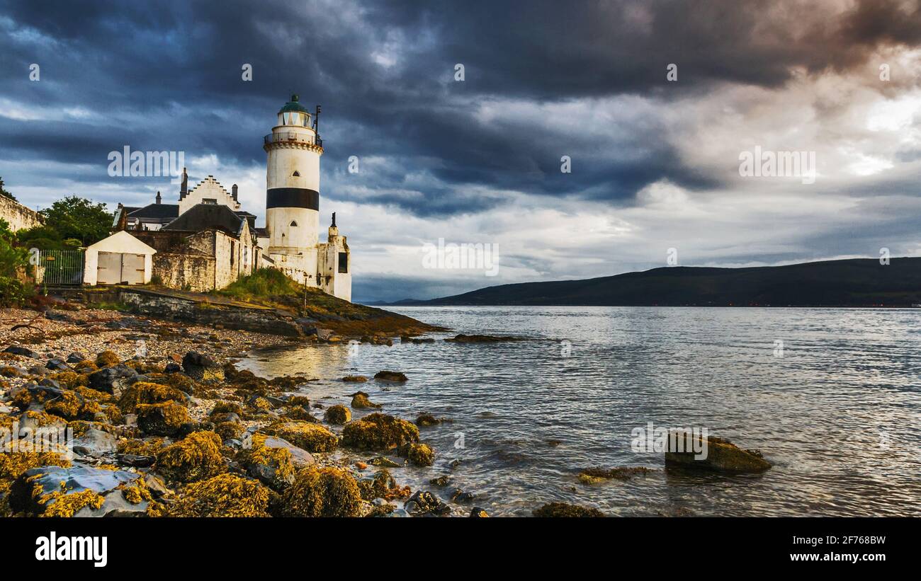 Evening by the lighthouse at Cloch Point on the Firth of Clyde, Scotland. Stock Photo