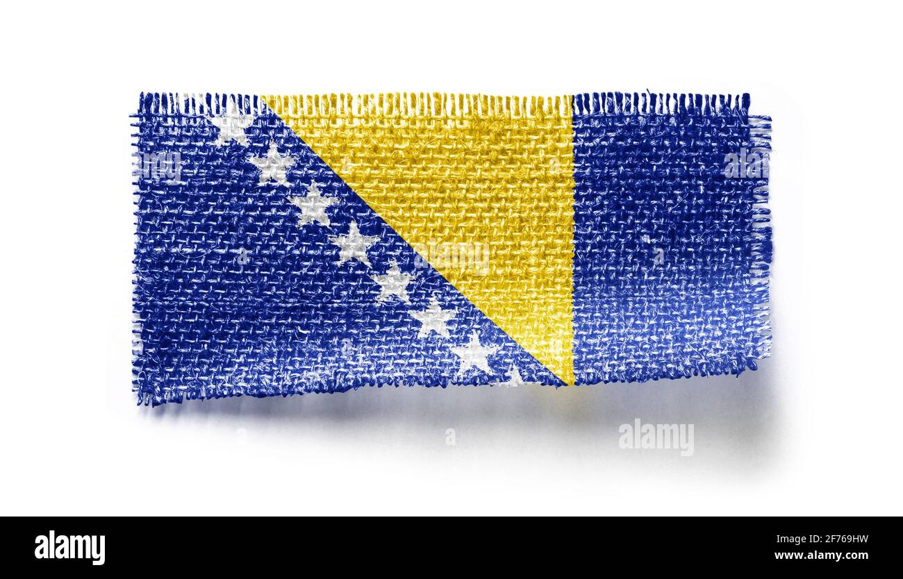 Bosnia and Herzegovina flag on a piece of cloth on a white background Stock Photo