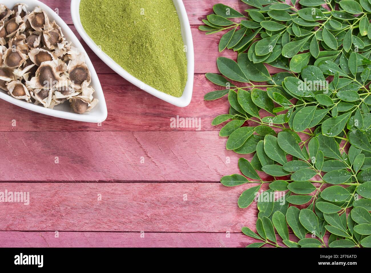 Leaves, seeds and moringa powder. Top view Moringa oleifera Stock