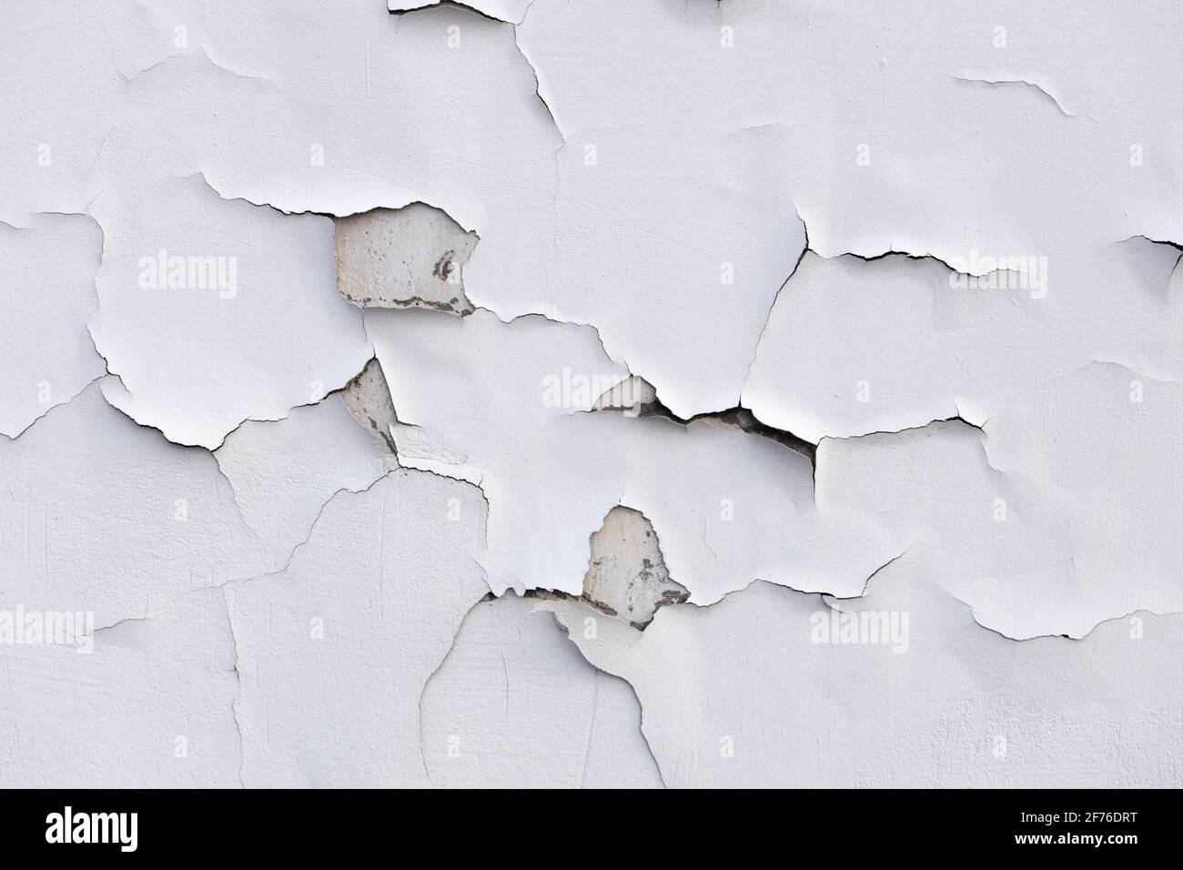 concrete wall with white cracked paint. High quality photo Stock Photo