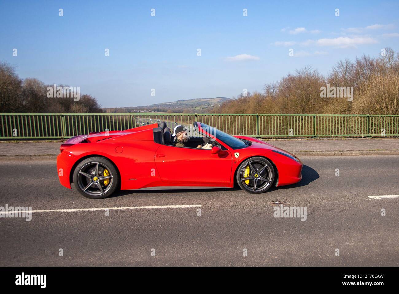 2014 red Ferrari 458 Spider Dct S-A 4497cc; The Ferrari 458 Italia (Type F142) is a mid-engine sports car produced by the Italian automobile manufacturer. Stock Photo