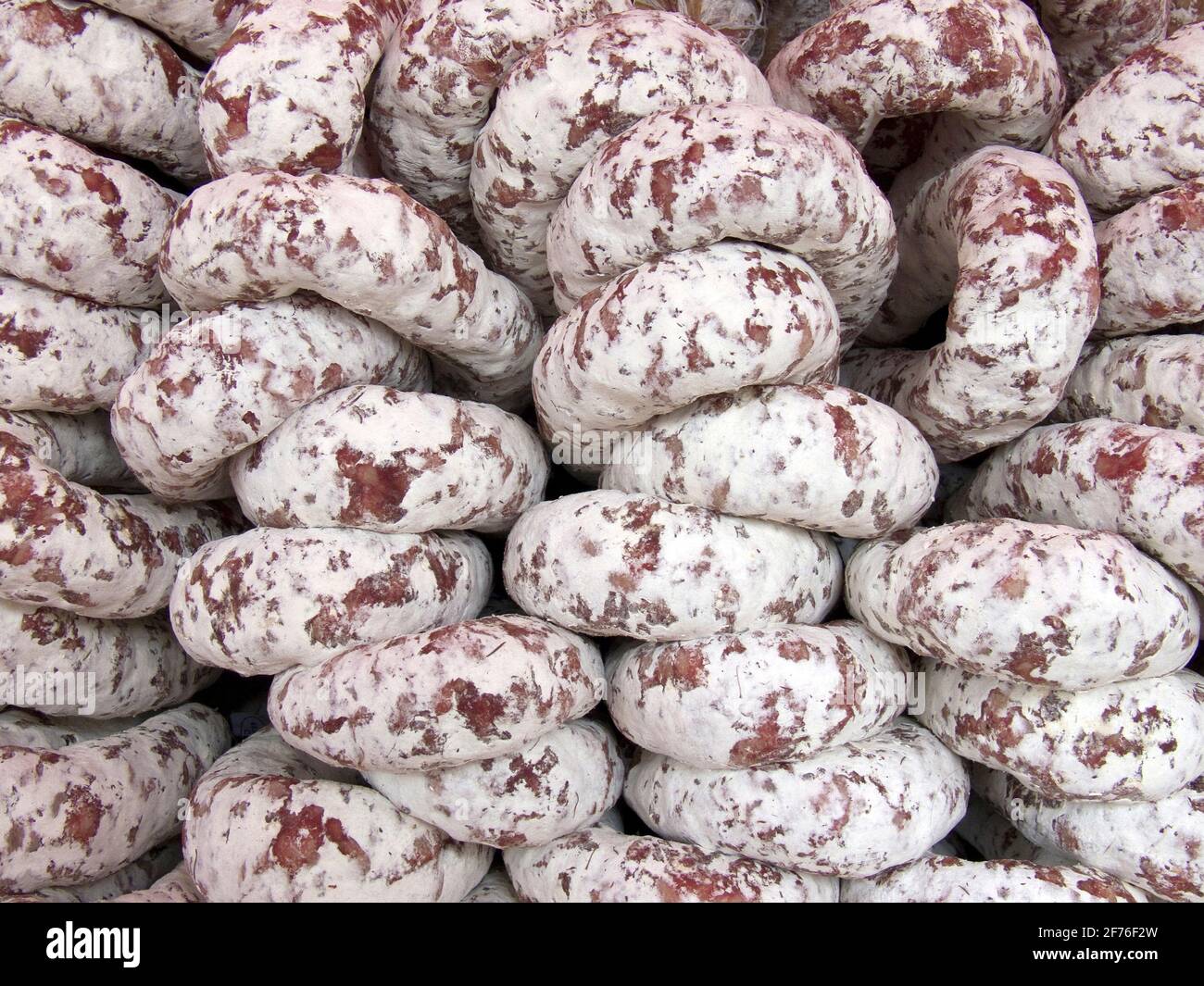 Pile of delicious salami sausages Stock Photo