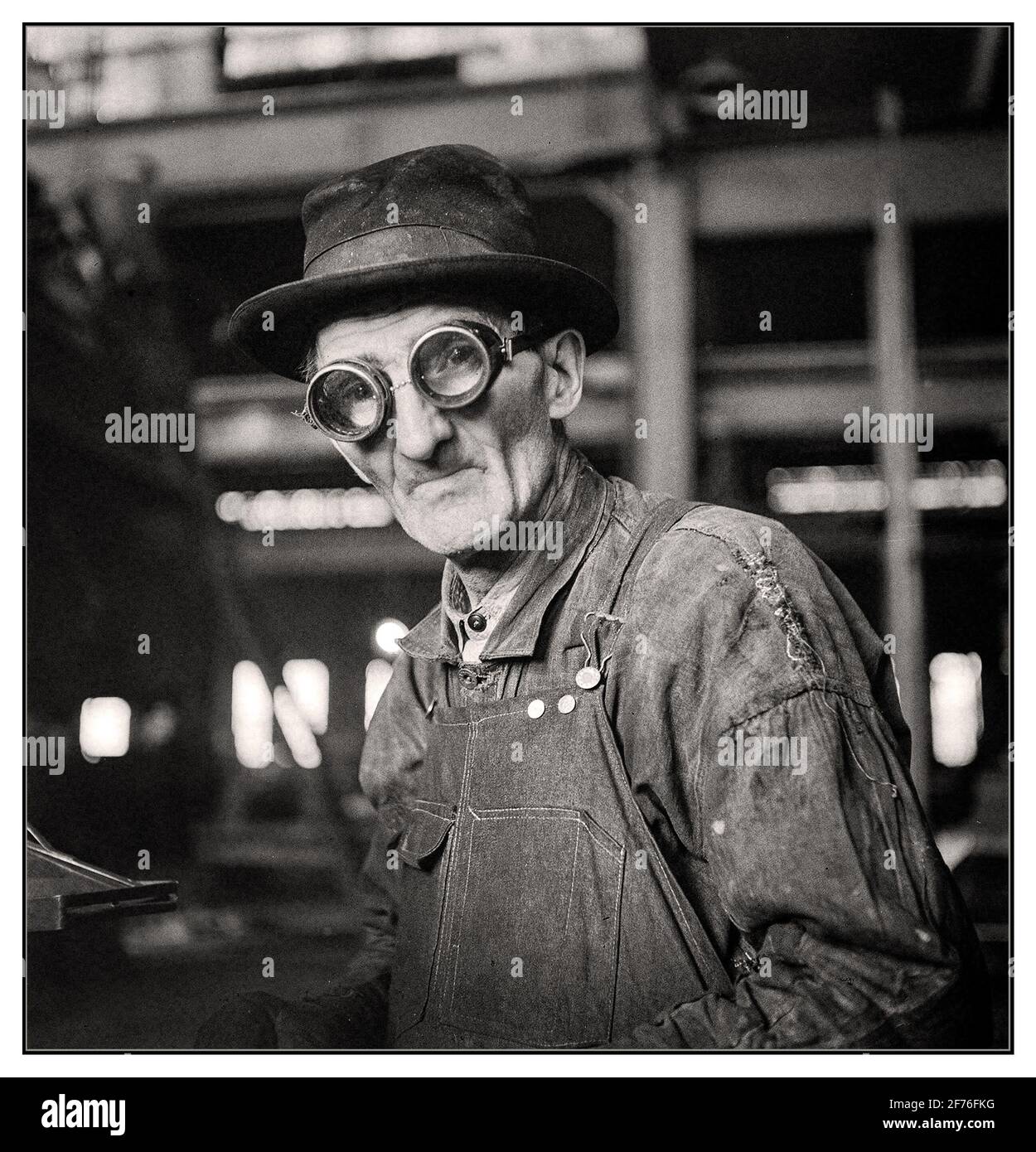 December 1942 War Worker WW2. “Chicago, Illinois. Workman grinding out a small part at the Chicago & North Western repair shops.” Medium-format negative by Jack Delano for the Office of War Information. America War Production World War II Stock Photo