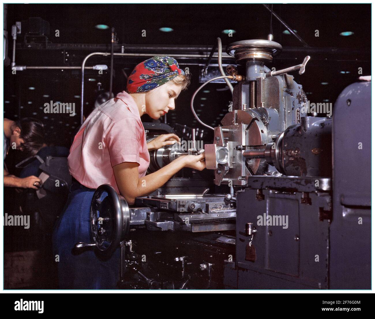 WW2 America War work production October 1942. “Women become skilled shop technicians after careful training in the school at the Douglas Aircraft Company plant in Long Beach, California. Planes made here include the B-17F Flying Fortress heavy bomber, A-20 assault bomber and C-47 transport.” Stock Photo