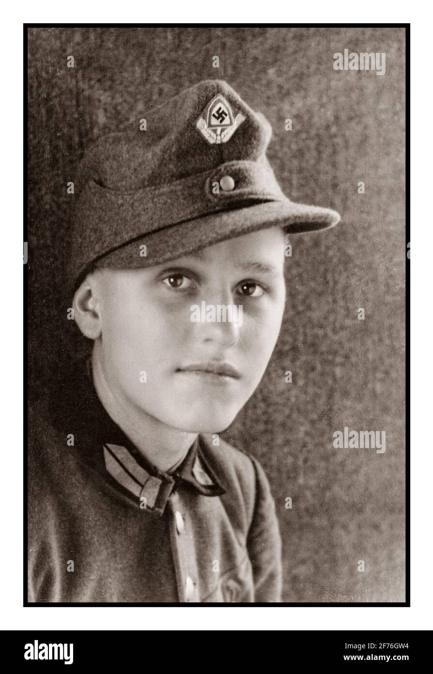 RAD NAZI GERMANY 1930’s Portrait Teenager Boy Reichsarbeitsdienst National Labour Service Uniform with cap badge displaying Swastika emblem and ears of corn with spade symbol WW2 Nazi Germany Teenager Boy Reichsarbeitsdienst volunteer labour force REICH LABOUR SERVICE Stock Photo