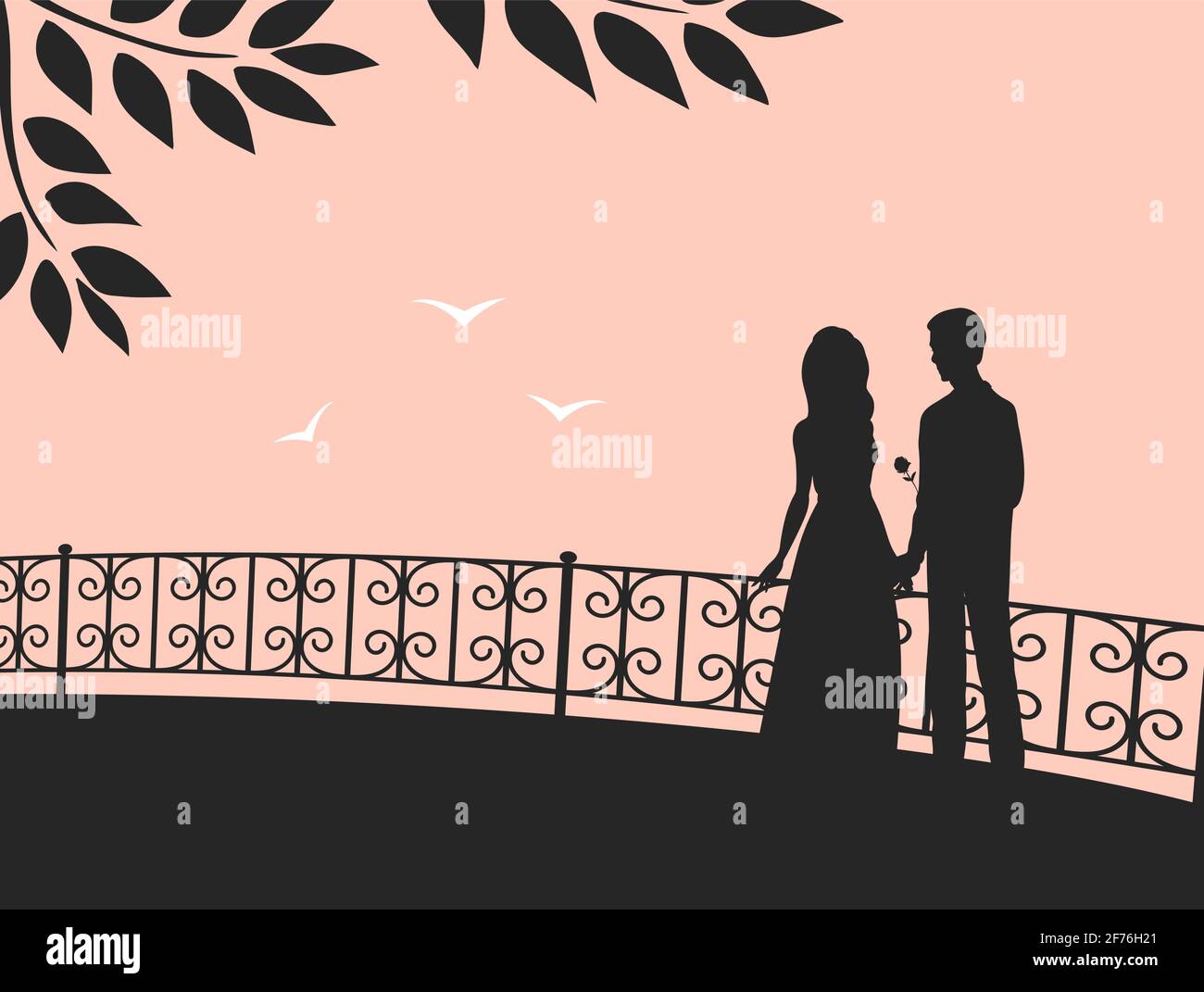 Silhouette of a couple in love on the background of the evening sky. A ...