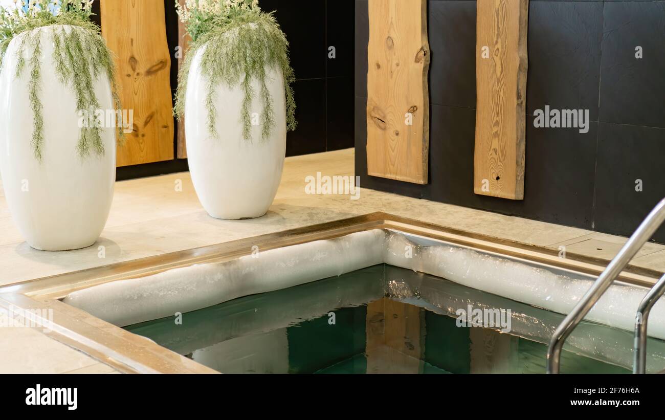 Ice edge on the edge of the plunge bath with very cold water for