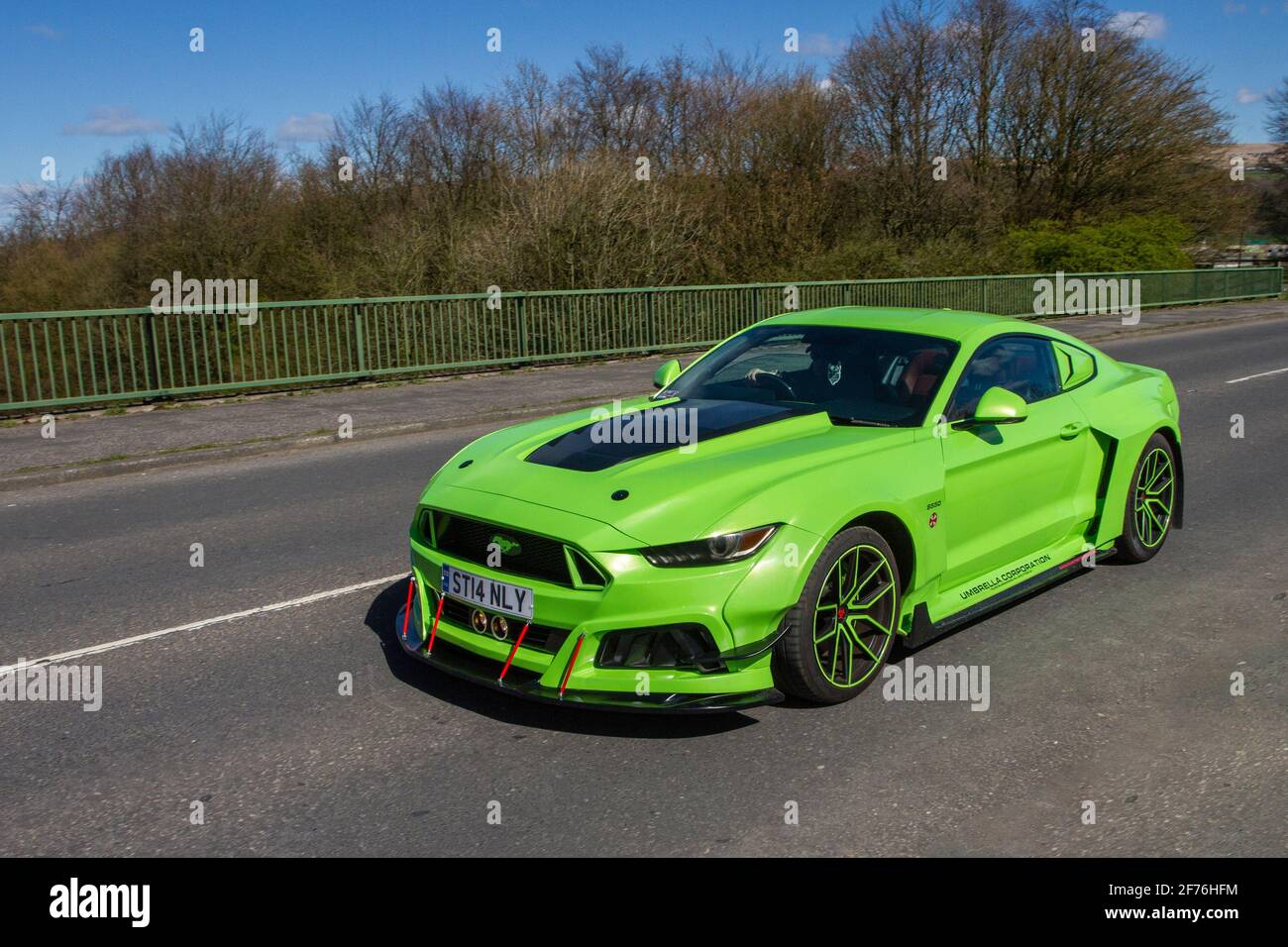 2017 green Ford Mustang GT 5951cc petrol coupe; Vehicular traffic moving vehicles, cars driving vehicle on UK roads, motors, motoring on the M6 motorway highway network. Stock Photo
