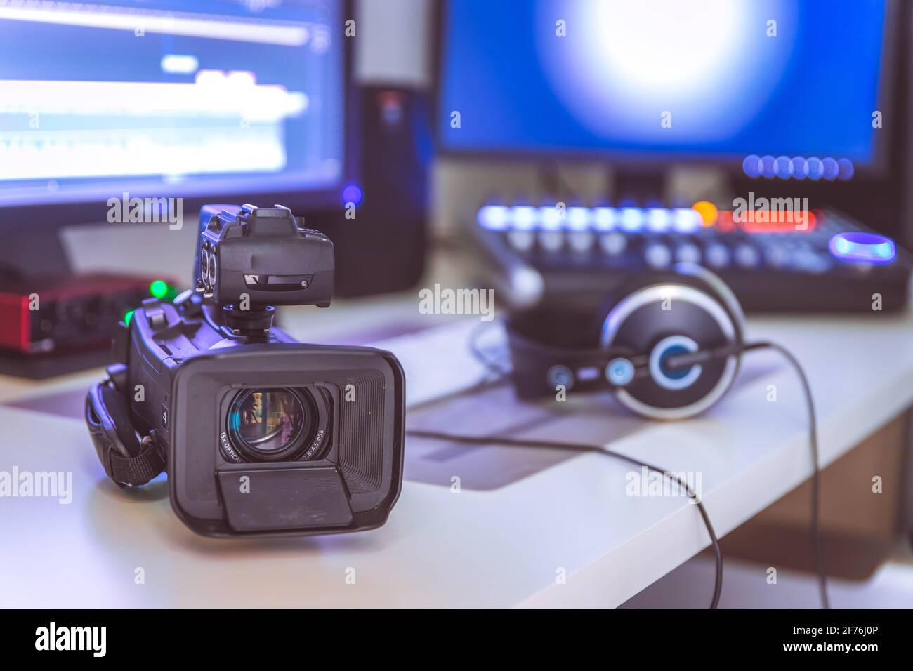 Video editing, recording and cutting room with monitors, camera and sound mixing desk Stock