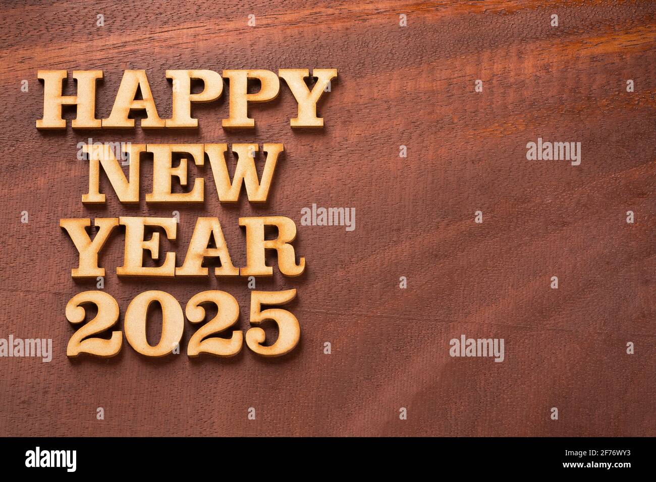 Happy new year 2025 in wooden letters Text space Stock Photo Alamy