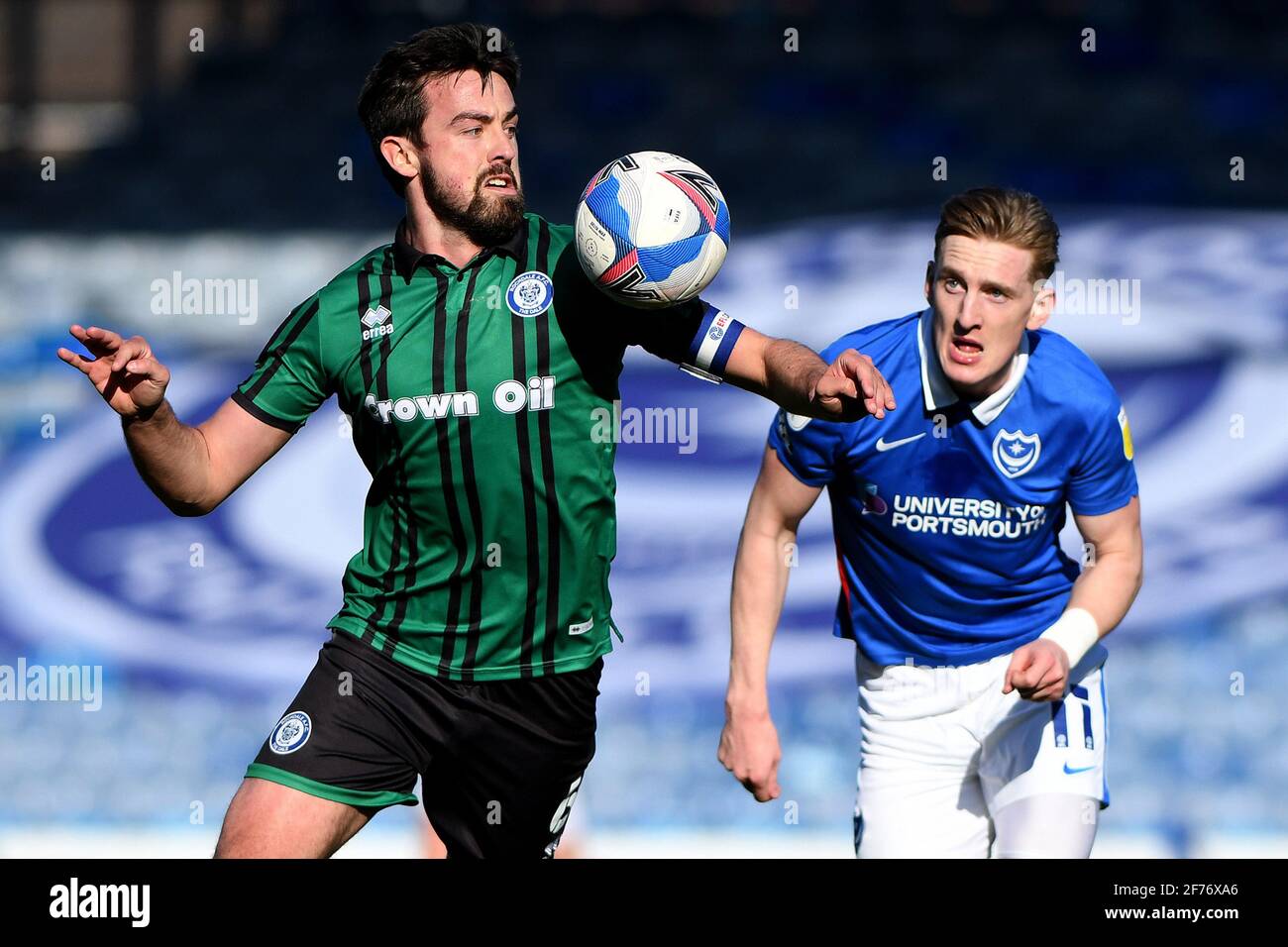 Eoghan O'Connell of Rochdale and Ronan Curtis of Portsmouth - Portsmouth v Rochdale, Sky Bet League One, Fratton Park, Portsmouth, UK - 2nd April 2021  Editorial Use Only - DataCo restrictions apply Stock Photo