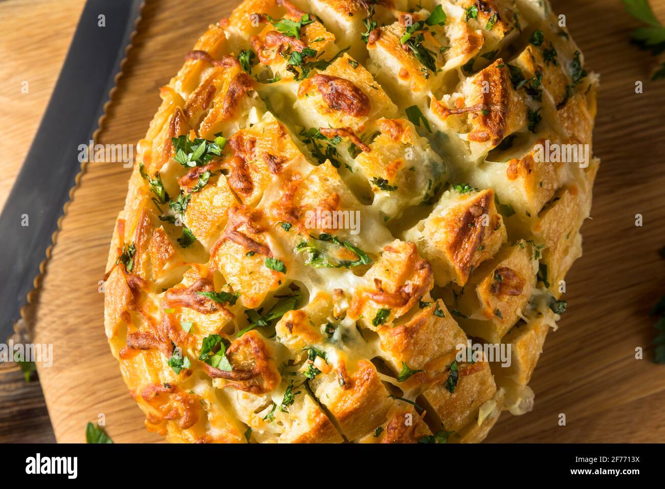 Homemade Cheesy Pull Apart Garlic Bread with Parsley Stock Photo
