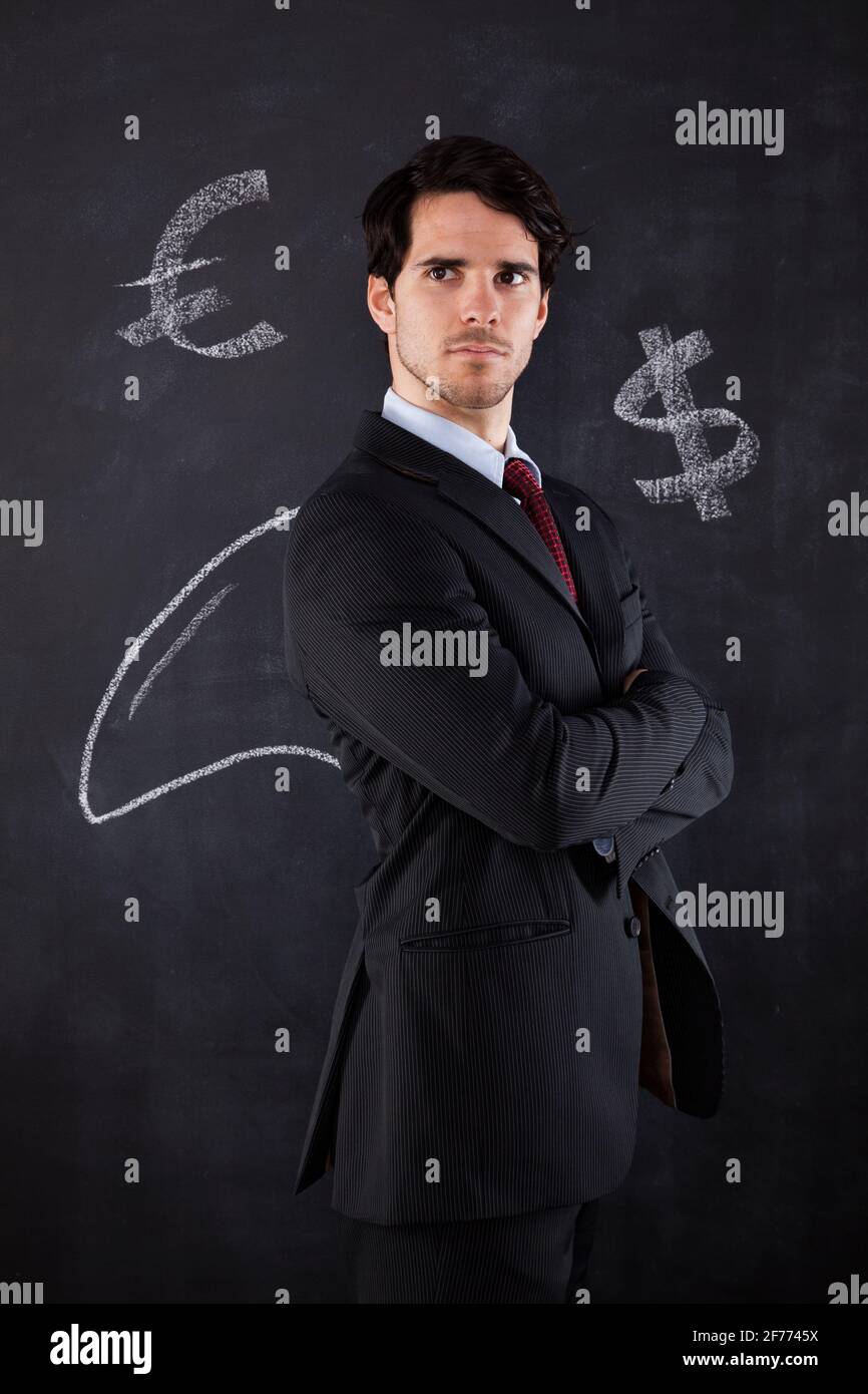 Businessman with a shark fin draw on the blackboard Stock Photo
