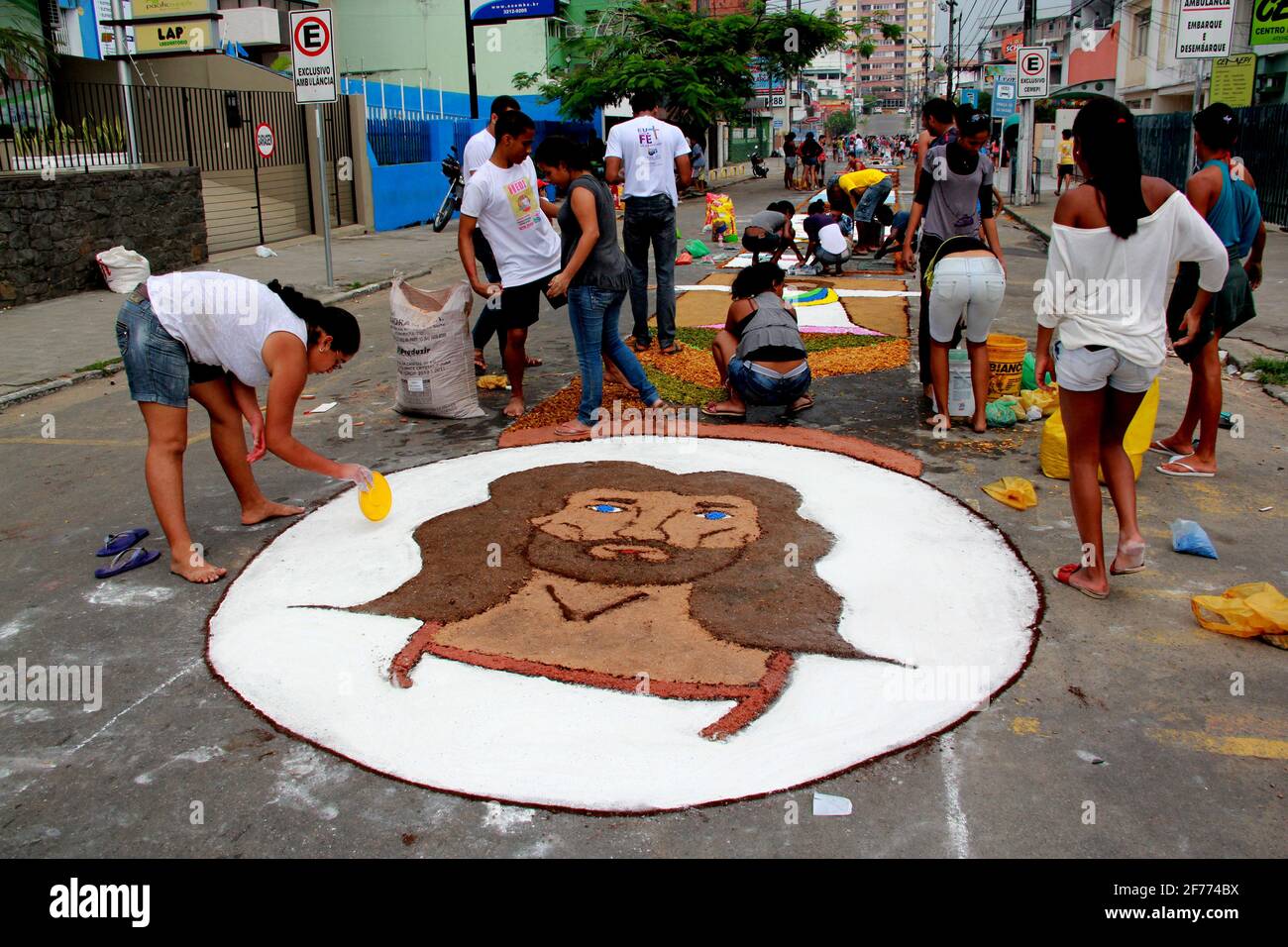 Itabuna, Bahia / Brazil - June 7, 2012: People are seen making traditional tapes during the Corpus Crist holiday festivities in Itabuna. *** Local Cap Stock Photo