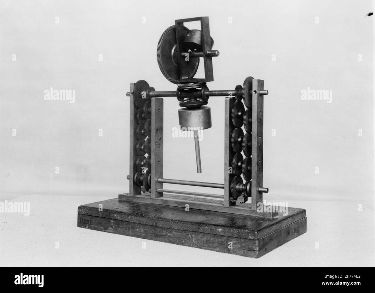 Model to Perpetuum Mobile, built on the principle of rotating and falling weights. Stock Photo