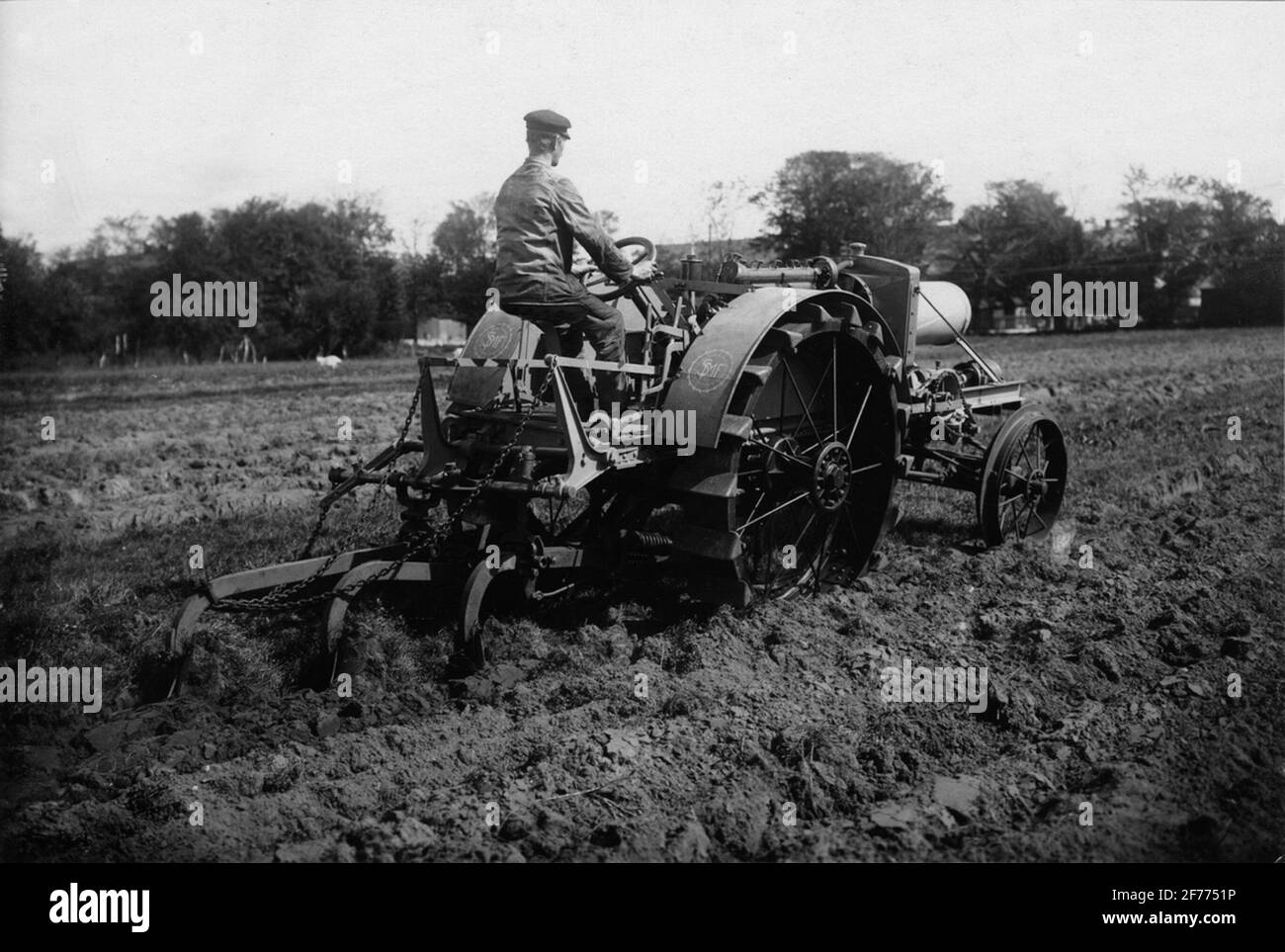 Vehicle tractor with plow Stock Photo - Alamy