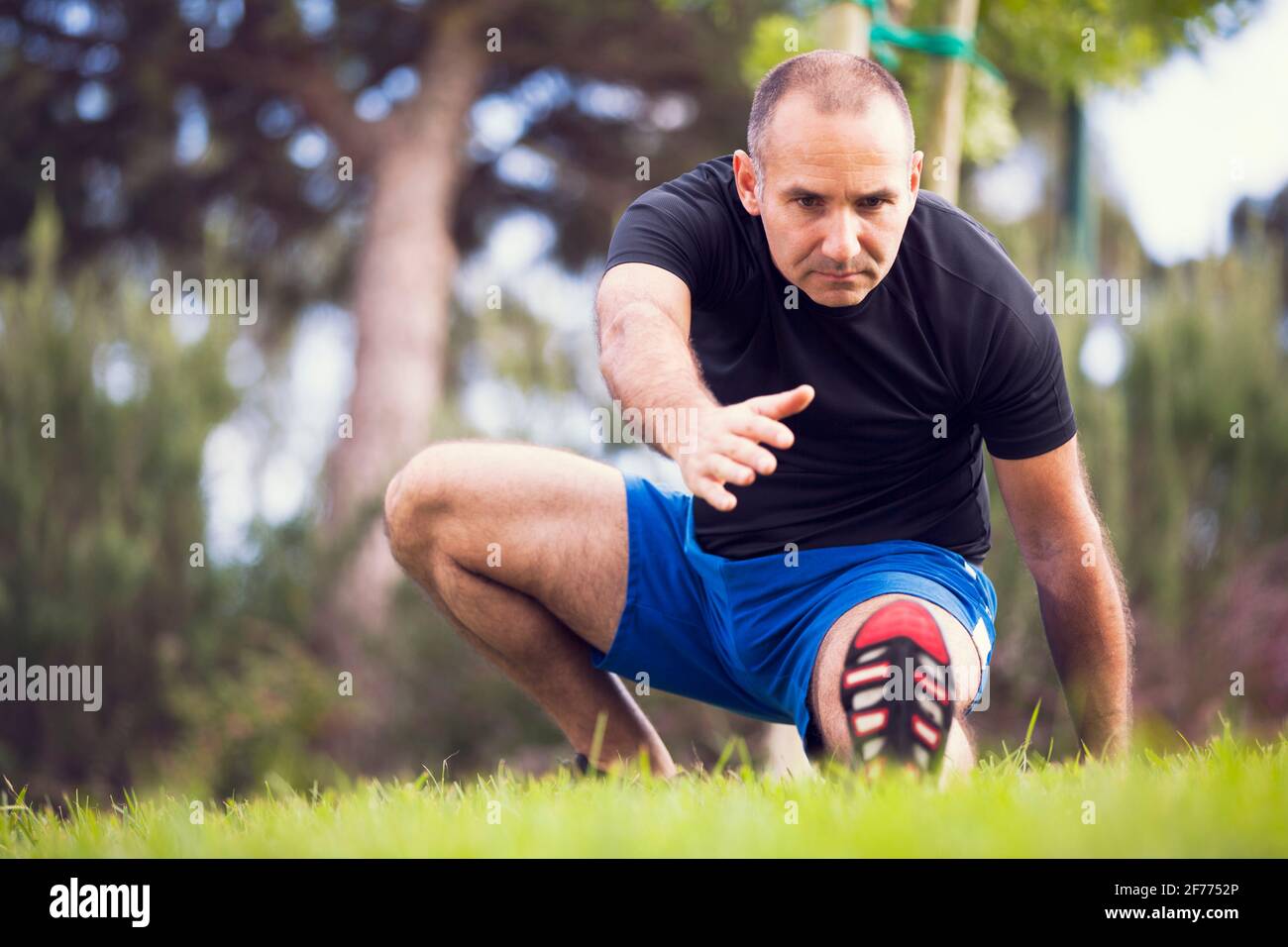 Mature man exercise in a city park Stock Photo