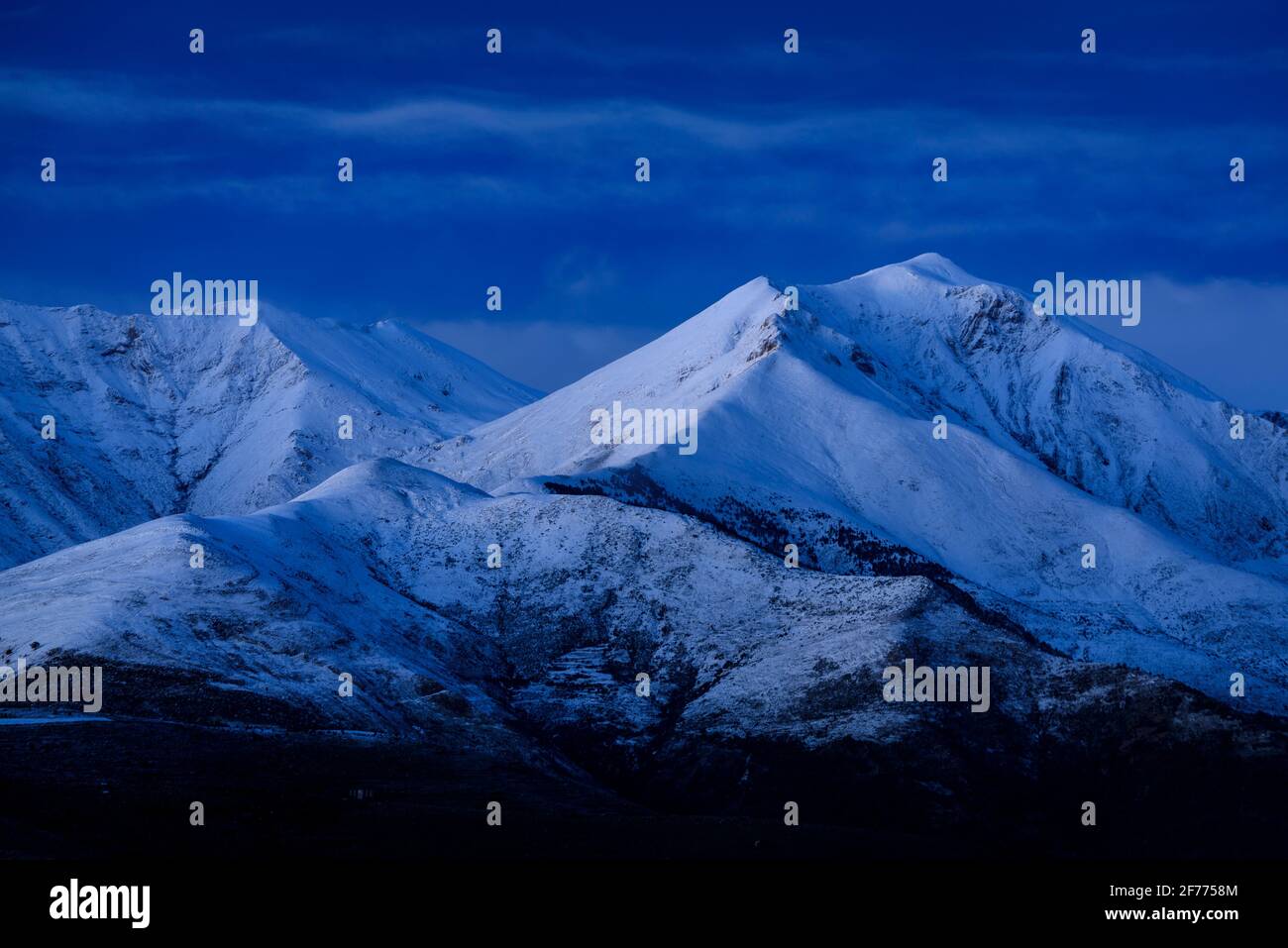 Twilight and blue hour in Pyrenees, at Pica Cerví summit, viewed from the Creu de Perves pass (Alta Ribagorça, Catalonia, Pyrenees, Spain) Stock Photo